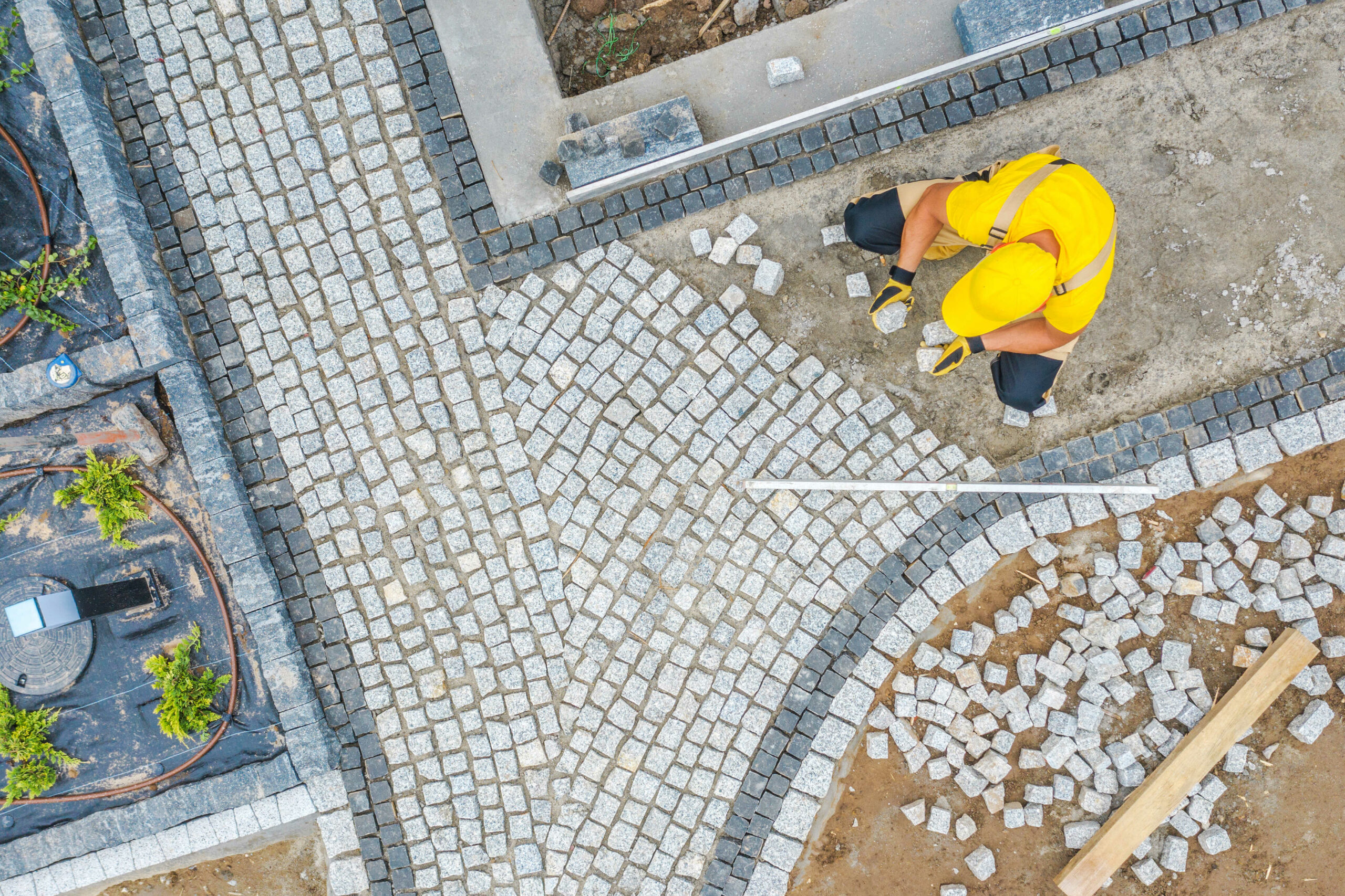 worker-paving-garden-path-aerial-vista-hznjzn2_optimized